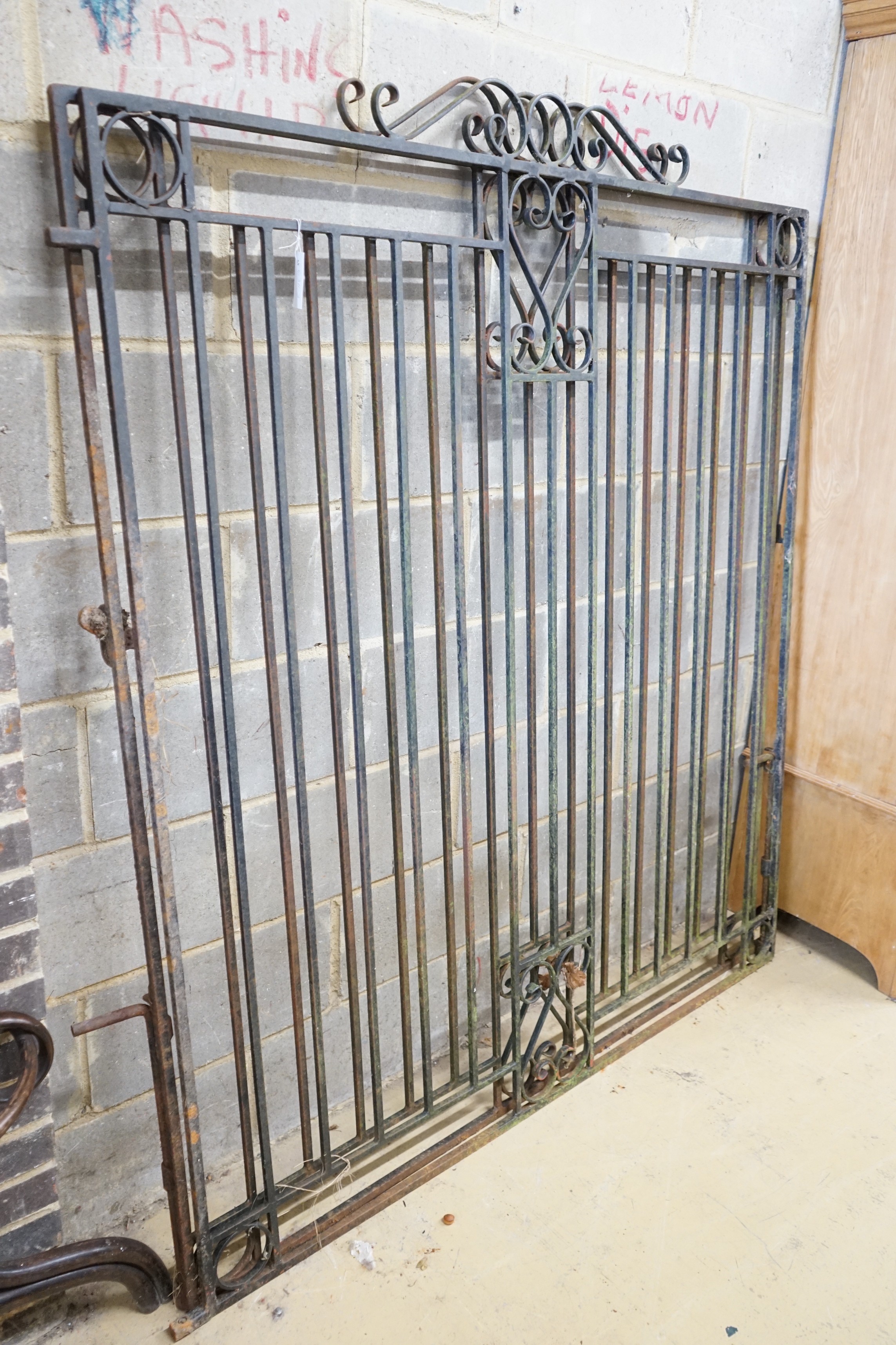 A pair of large wrought iron gates, each width 151cm, height 176cm